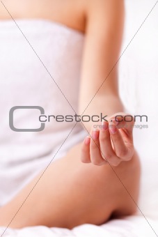 Close up shot of a young woman fingers while doing yoga