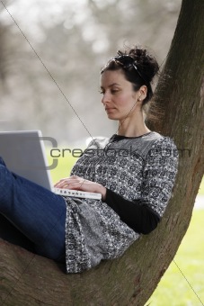 young woman working on laptop