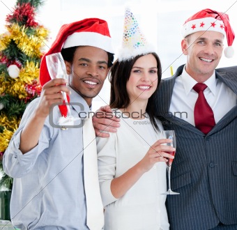 United business team drinking champagne to celebrate christmas