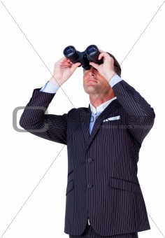 Confident businessman using binoculars 