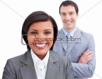 Radiant businesswoman posing in front of her colleague