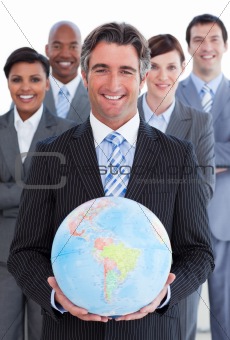 Ambitious business team showing a terrestrial globe