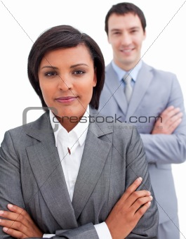 Ethnic businesswoman posing in front of her colleague