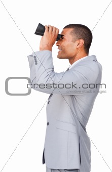 Young afro-american businessman using binoculars 