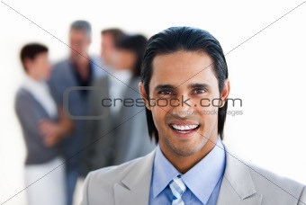 Charming businessman in front of his team 