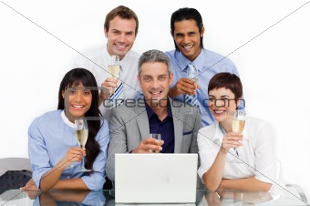 Successfull business team toasting with Champagne 