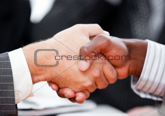Close-up of a handshake between two businessmen