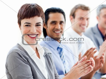 A diverse business group clapping a good presentation