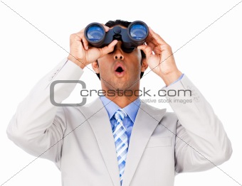 Surprised businessman looking through binoculars