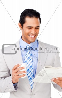 Attractive asian businessman driking coffee and reading a newspa