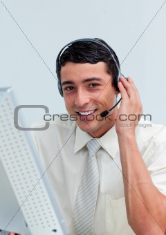 Assertive businessman using headset 