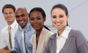 Multi-ethnic business team sitting in a row 