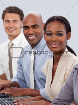 Diverse confident business team sitting in a row 
