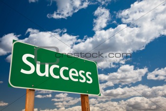 Success Green Road Sign with Copy Room Over The Dramatic Clouds and Sky.