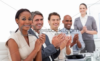 Positive business team applauding a good presentation