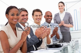 Happy business team applauding a good presentation