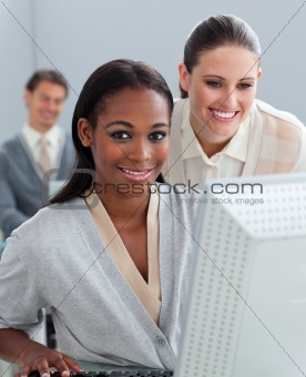 Portrait of two businesswomen working at a computer