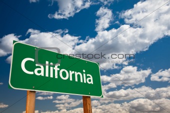 California Green Road Sign with Copy Room Over The Dramatic Clouds and Sky.