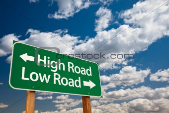 High Road, Low Road Green Road Sign with Copy Room Over The Dramatic Clouds and Sky.