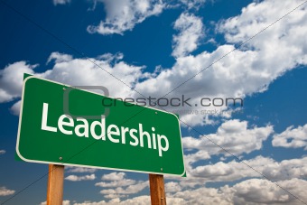 Leadership Green Road Sign with Copy Room Over The Dramatic Clouds and Sky.