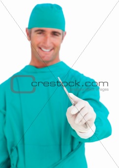 Assertive surgeon holding a stethoscope