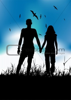 Couple walking on summer meadow, black silhouette