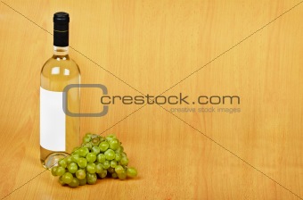 Open arrangement of bottle of white wine