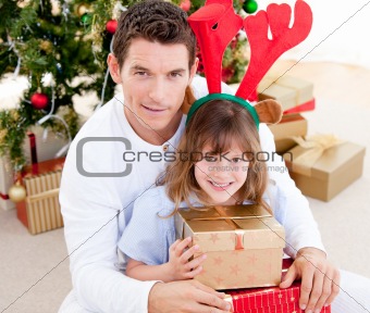 Handsome father celebrating christmas with his daughter