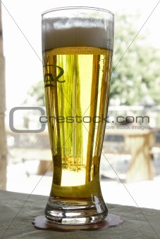 glass of beer on street cafe terrace background