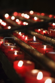 Group of lit church candles in Lisbon, Portugal.