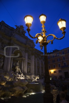 Trevi Fountain in Rome, Italy lit up at night.
