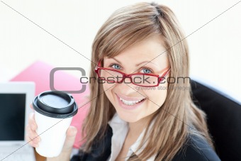 Beautiful businesswoman drinking coffee 
