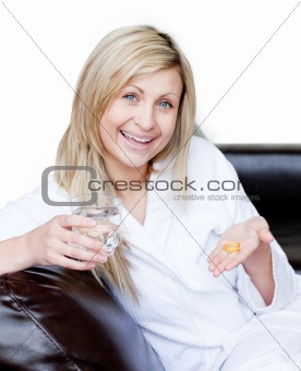 Happy woman holding medicine