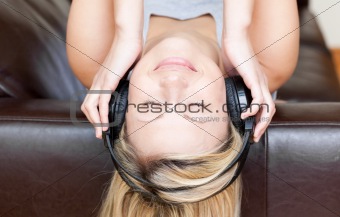 Calm woman using headphones 