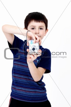 Young boy with digital camera