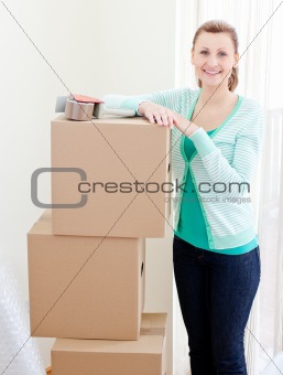 Beautiful woman closing various boxes