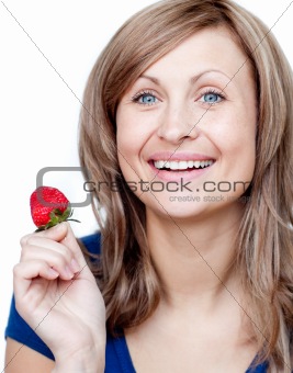 Attractive woman eating strawberries 