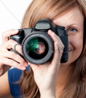 Smiling woman using a camera 
