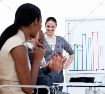 Jolly business team applauding in a meeting
