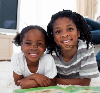 Close-up of siblings reading