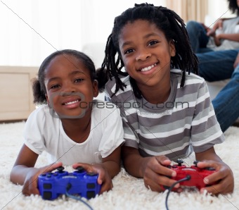 Close-up of siblings playing video game