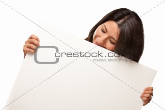 Attractive Multiethnic Woman Holding Blank White Sign Isolated on a White Background.
