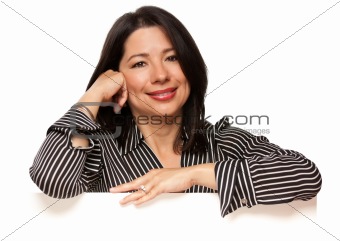 Attractive Multiethnic Woman Leaning on Blank White Sign Corner Isolated on a White Background.