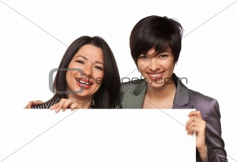 Attractive Multiethnic Mother and Daughter Holding Blank White Sign Isolated on a White Background.
