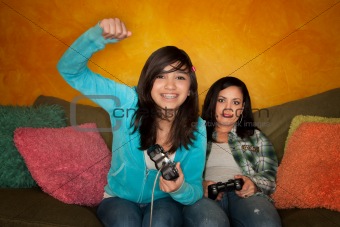 Hispanic Woman and Girl Playing Video game