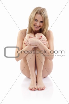  woman sitting hugging legs