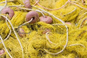 Tangled fishing tackle: net, float, rope close-up