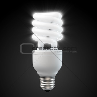 White energy saving light bulb on black