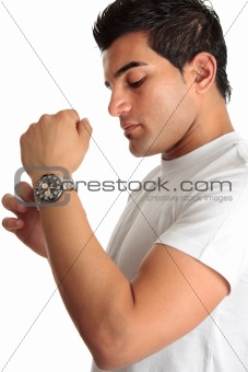 Man putting on chronograph watch