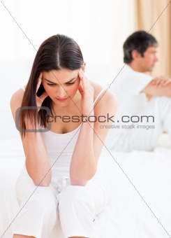 Distress couple sitting sitting separately after having a row 
